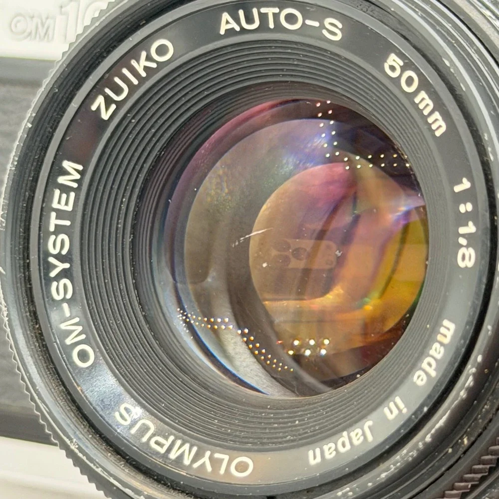 Olympus OM10 35mm Film SLR Camera with Zuiko Auto-S 50mm f1.8 Lens Silver Black